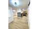 Well-lit open floor plan with modern flooring, connecting living and kitchen areas at 4248 Tara Ave # 2, Las Vegas, NV 89102