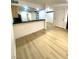 Spacious living room featuring modern flooring and seamless access to the kitchen at 4248 Tara Ave # 2, Las Vegas, NV 89102