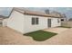 This backyard features a patio and low-maintenance landscaping with turf and rock, perfect for outdoor living at 427 Wright Way, Henderson, NV 89015