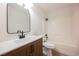 Bright bathroom featuring sleek fixtures, a vanity with storage, and a shower-tub combo at 427 Wright Way, Henderson, NV 89015