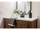 Bathroom vanity featuring updated fixtures, cabinet, and white countertops at 427 Wright Way, Henderson, NV 89015