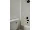 Close-up of bathroom with white tiled walls, modern black fixtures, and white toilet at 427 Wright Way, Henderson, NV 89015