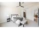 Neutral bedroom with gray bed, ceiling fan and an ensuite bathroom at 427 Wright Way, Henderson, NV 89015