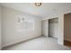 This bedroom offers neutral walls, carpet floors, a window providing natural light and a closet with sliding doors at 427 Wright Way, Henderson, NV 89015