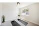 Bedroom with carpet and neutral walls offers space for yoga, complemented by two yoga mats and natural light at 427 Wright Way, Henderson, NV 89015