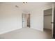 Bedroom with neutral walls, carpet, closet, and access to the en-suite bathroom at 427 Wright Way, Henderson, NV 89015