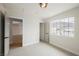 Bright bedroom with neutral walls, carpet, a large window with a mountain view, and a closet at 427 Wright Way, Henderson, NV 89015