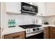 Contemporary kitchen features stainless steel appliances and white subway tile backsplash at 427 Wright Way, Henderson, NV 89015