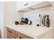 Modern kitchen counter with white countertops, dark hardware, and sleek finishes at 427 Wright Way, Henderson, NV 89015