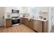 Updated kitchen features stainless steel appliances, white countertops and two-tone cabinetry at 427 Wright Way, Henderson, NV 89015