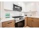 Modern kitchen features stainless steel appliances and white countertops with subway tile backsplash at 427 Wright Way, Henderson, NV 89015