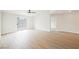 Spacious living room with hardwood floors, sliding glass doors, and a ceiling fan at 427 Wright Way, Henderson, NV 89015