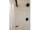 Detail shot of modern shower with black rainfall shower head and tile surround at 427 Wright Way, Henderson, NV 89015