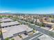 Suburban neighborhood aerial view with neatly landscaped homes, trees, and a view of the distant mountains at 4277 Sunrise Flats St, Las Vegas, NV 89135