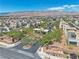 Expansive aerial view showcasing the community's layout, desert landscaping, and the majestic mountain backdrop at 4277 Sunrise Flats St, Las Vegas, NV 89135