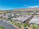 Suburban neighborhood with well-maintained streets, modern homes, lush landscaping, and mountain views at 4277 Sunrise Flats St, Las Vegas, NV 89135