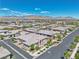 Elevated aerial shot showcasing suburban living with neatly arranged homes, landscaping, and scenic mountain views at 4277 Sunrise Flats St, Las Vegas, NV 89135