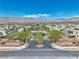 Panoramic aerial view of a Primary-planned community with mountains in the distance under a bright sky at 4277 Sunrise Flats St, Las Vegas, NV 89135