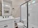 Modern bathroom features walk-in shower with white subway tile and glass door, along with a stylish vanity at 4277 Sunrise Flats St, Las Vegas, NV 89135