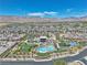Aerial view of community center with pool, tennis courts and green areas, set within a vibrant neighborhood at 4277 Sunrise Flats St, Las Vegas, NV 89135