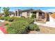 Street view featuring attractive landscaping, a stone accent wall, and a well-maintained exterior at 4277 Sunrise Flats St, Las Vegas, NV 89135