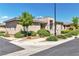 Beautiful exterior showcasing a stone accent wall, manicured landscaping and a tranquil neighborhood setting at 4277 Sunrise Flats St, Las Vegas, NV 89135