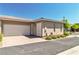 View of the property featuring a two-car garage with a brick driveway, and low-maintenance landscaping at 4277 Sunrise Flats St, Las Vegas, NV 89135