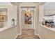 Inviting hallway leads to a spacious living area, showcasing modern interior design and ample natural light at 4277 Sunrise Flats St, Las Vegas, NV 89135
