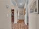 Hallway features wood-look tile flooring, recessed lighting, and decorative wall art at 4277 Sunrise Flats St, Las Vegas, NV 89135