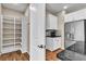 Modern kitchen with stainless steel appliances, white cabinetry, and a pantry at 4277 Sunrise Flats St, Las Vegas, NV 89135