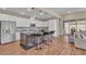Bright kitchen with a large island, stainless steel appliances, and wood tile flooring at 4277 Sunrise Flats St, Las Vegas, NV 89135