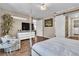 Inviting main bedroom has wood-look tile flooring and en-suite bathroom at 4277 Sunrise Flats St, Las Vegas, NV 89135