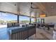 Expansive covered outdoor patio with multiple seating areas, perfect for relaxation and socializing at 4277 Sunrise Flats St, Las Vegas, NV 89135