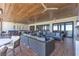 Extensive covered outdoor patio area with ceiling fans and luxury outdoor furniture at 4277 Sunrise Flats St, Las Vegas, NV 89135