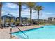 Inviting pool with comfortable cabanas and well-kept landscaping for a luxurious feel at 4277 Sunrise Flats St, Las Vegas, NV 89135