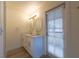 Bright bathroom featuring double sink vanity, white cabinets, and a mirror at 5040 Spencer St # D, Las Vegas, NV 89119