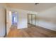 Bright bedroom with wood floors and a mirrored closet at 5040 Spencer St # D, Las Vegas, NV 89119