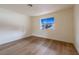 Cozy bedroom with natural light and wood flooring at 5040 Spencer St # D, Las Vegas, NV 89119
