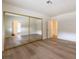 Spacious bedroom with wood flooring, closet, and natural light at 5040 Spencer St # D, Las Vegas, NV 89119