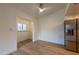 Bright dining area featuring wood-look flooring and adjacent stainless steel refrigerator at 5040 Spencer St # D, Las Vegas, NV 89119