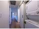 Hallway featuring wood flooring, a laundry nook, and access to other rooms at 5040 Spencer St # D, Las Vegas, NV 89119