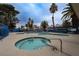 Community hot tub with inviting blue tile accents, part of a larger pool area at 5040 Spencer St # D, Las Vegas, NV 89119