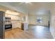 Open-concept kitchen with stainless steel appliances, white cabinets, and adjacent dining and living areas at 5040 Spencer St # D, Las Vegas, NV 89119