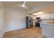 Bright kitchen featuring stainless steel appliances, white cabinetry, and quartz countertops at 5040 Spencer St # D, Las Vegas, NV 89119