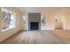 Bright living room featuring a fireplace and large windows, and light wood flooring at 5040 Spencer St # D, Las Vegas, NV 89119
