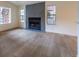 Modern living room featuring sleek wood-look flooring and a gray fireplace at 5040 Spencer St # D, Las Vegas, NV 89119