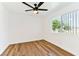 Cozy bedroom with modern ceiling fan, and light-filled window at 5078 Mountain Vista St, Las Vegas, NV 89120