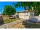 Charming single-Gathering home featuring well-kept landscaping and a welcoming front entrance at 5078 Mountain Vista St, Las Vegas, NV 89120