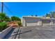 This is a detached garage featuring an open door, asphalt flooring, and is ready for a new owner at 5078 Mountain Vista St, Las Vegas, NV 89120