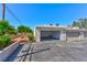 This is a detached garage featuring an open door, asphalt flooring, and is ready for a new owner at 5078 Mountain Vista St, Las Vegas, NV 89120
